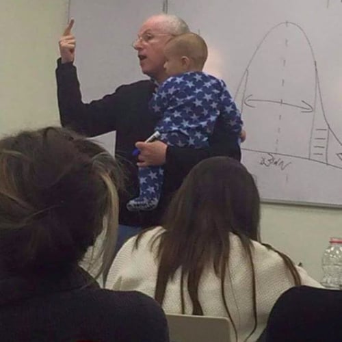 Professor Holds Baby While Teaching Class