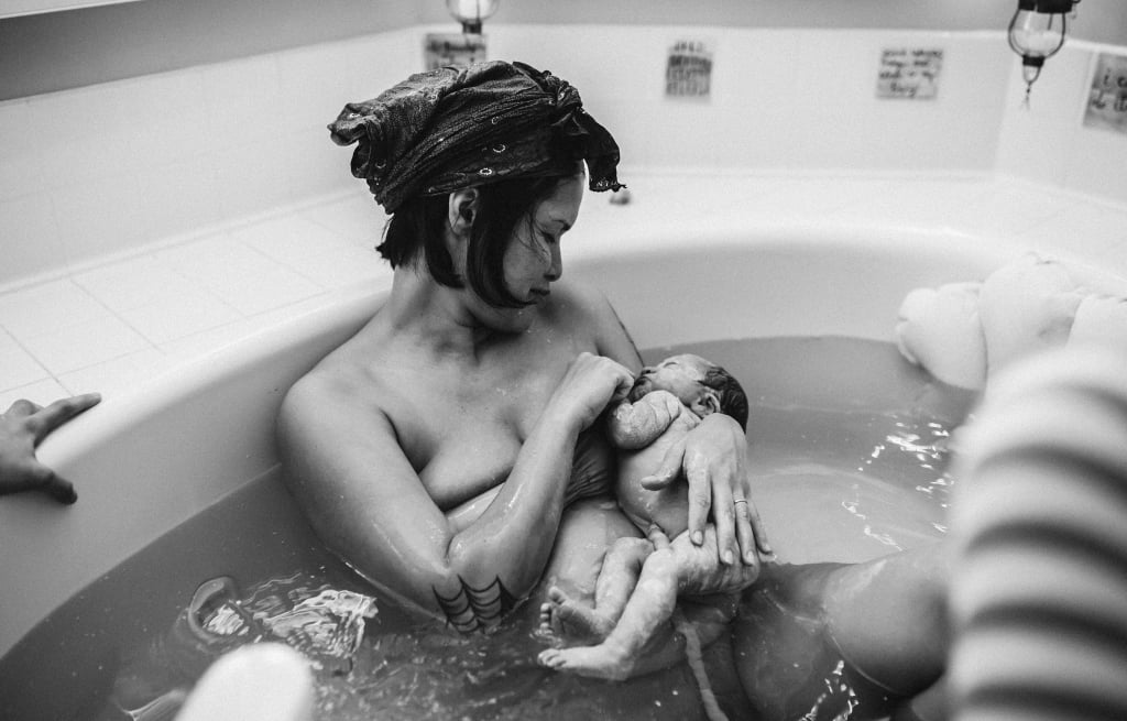 Mom Gives Birth With Daughters Present