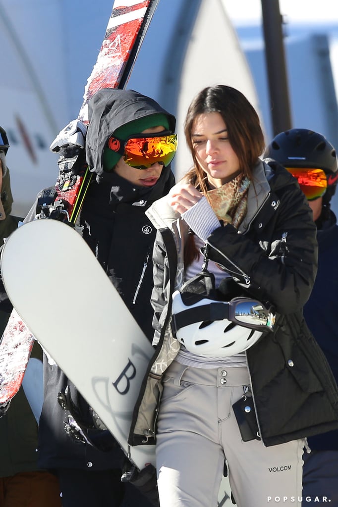 Harry and Kendall carried their snowboards.