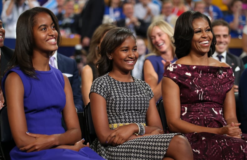 CHARLOTTE, NC - SEPTEMBER 06:  (L-R) Malia Obama, Sasha Obama, and First lady Michelle Obama listen as Democratic presidential candidate, U.S. President Barack Obama speaks on stage during the final day of the Democratic National Convention at Time Warner