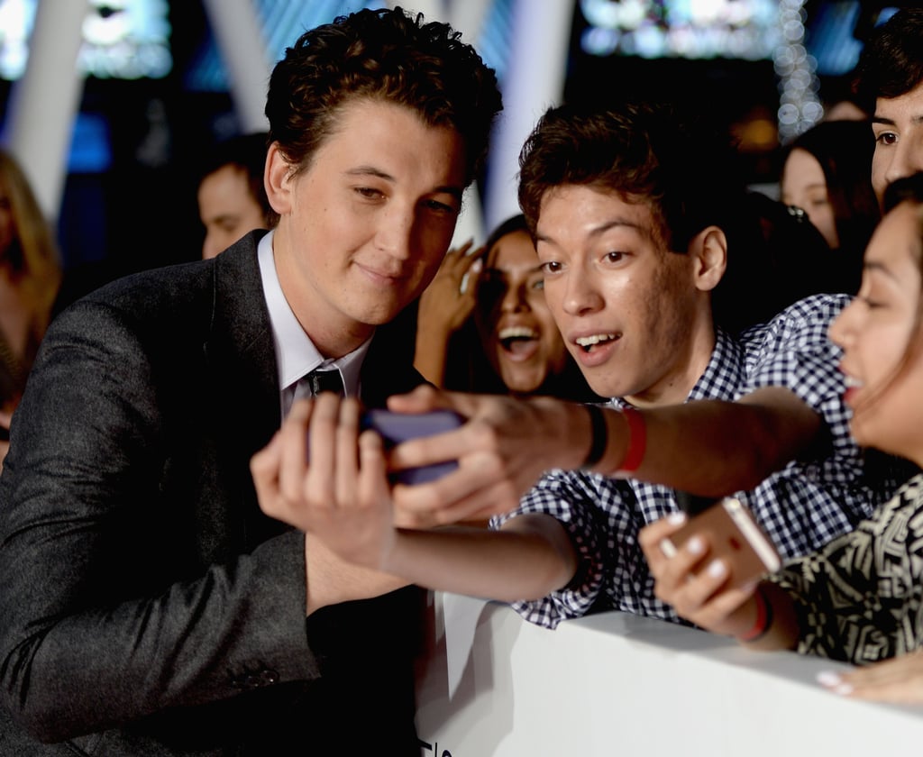 Miles Teller leaned in for a photo while walking the red carpet.