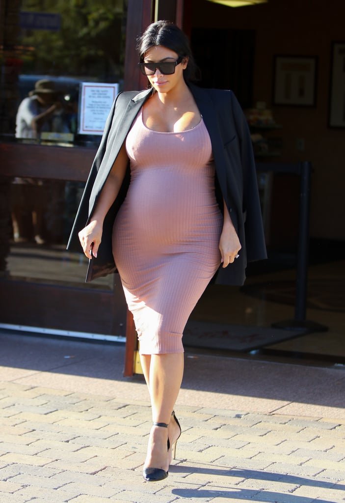 Kim topped off her pink ribbed dress with a chic black blazer as she stepped out in LA.