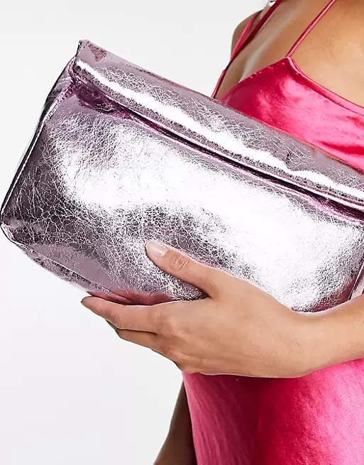 ASOS DESIGN Roll Top Clutch in Pink Metallic