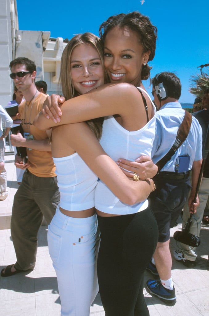 A fresh-faced Heidi Klum and Tyra Banks hugged during the festival in 2000.