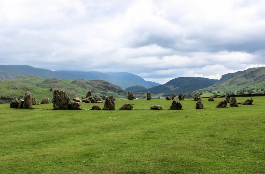 Although Stonehenge is the most iconic ring of standing stones, did you know there are more than 300 stone circles in England? Yes! In fact, one of them stands strong in the Lake District. 
Castlerigg Stone Circle is among the oldest and is perhaps the most atmospheric of all England's stone circles. With 38 stones aligning the panoramic views of the massive mountains in the distance, to say this circle is dramatically sited would be an understatement. The best part? It not only encompasses all of Stonehenge's beauty, without the clusters of crowds, but it's also free to explore. Plus, this stone circle is by no means roped off, so you can get as up close as you want. And there are families of sheep peacefully grazing on the surrounding beds of grass. If you want the full dramatic effect, go at sunset.