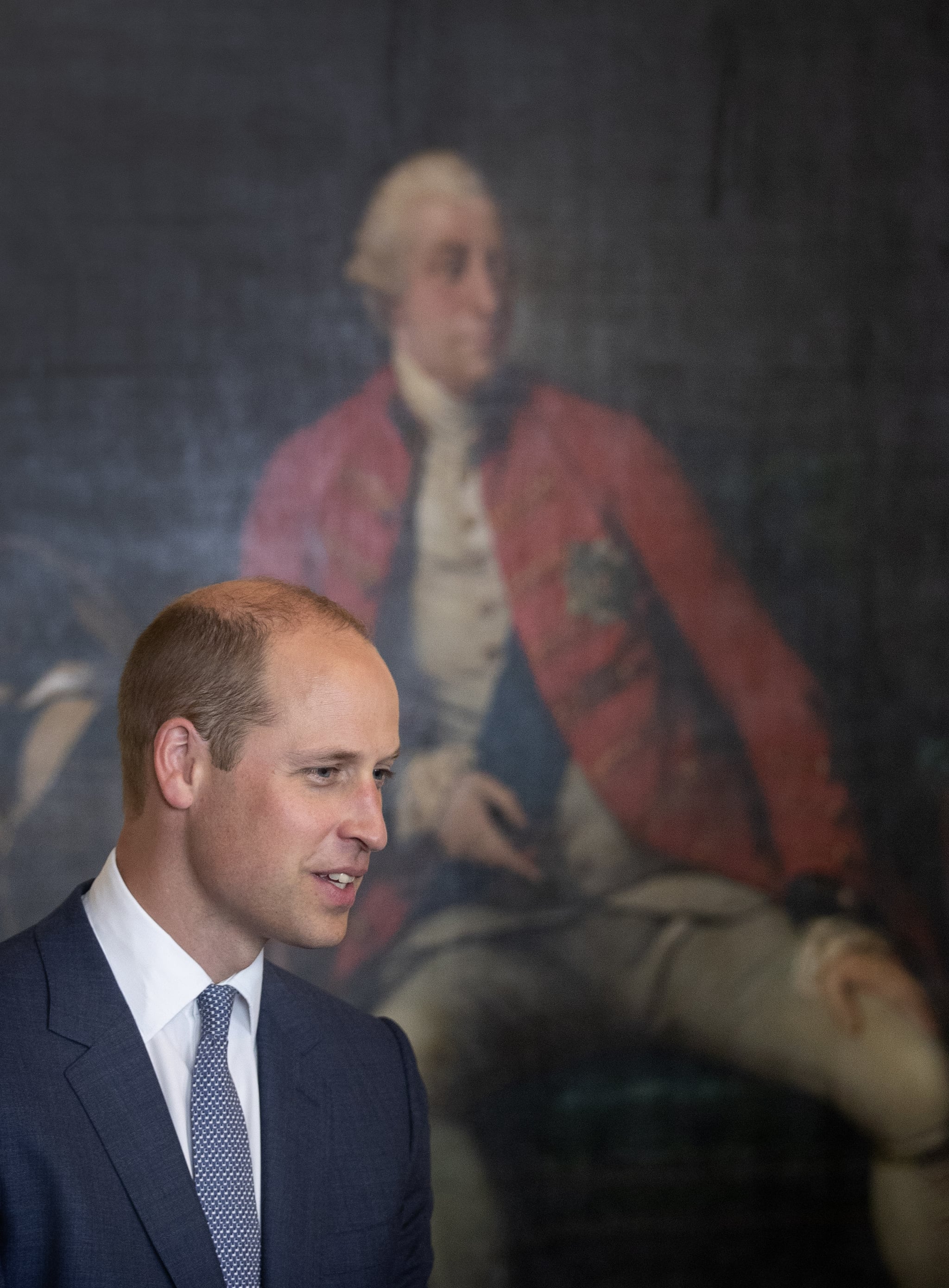 EDINBURGH, SCOTLAND - JULY 05:  Prince William, Duke Of Cambridge stands in front of a portrait of George III during a visit to the Royal Society of Edinburgh on July 05, 2018 in Edinburgh, Scotland. (Photo by Jane Barlow - WPA Pool/Getty Images)
