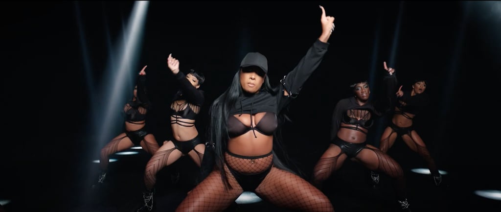 She drops it low completely in sync with her backup dancers.