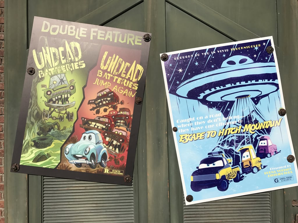 Halloween movie posters are hung around Cars Land.