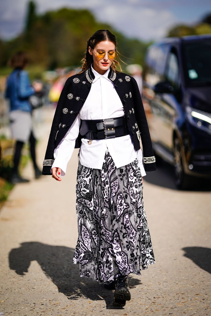Ladylike with a twist is some of Olivia's best work — this time, she updated a maxi skirt with combat boots, a military jacket, and a wide leather belt.