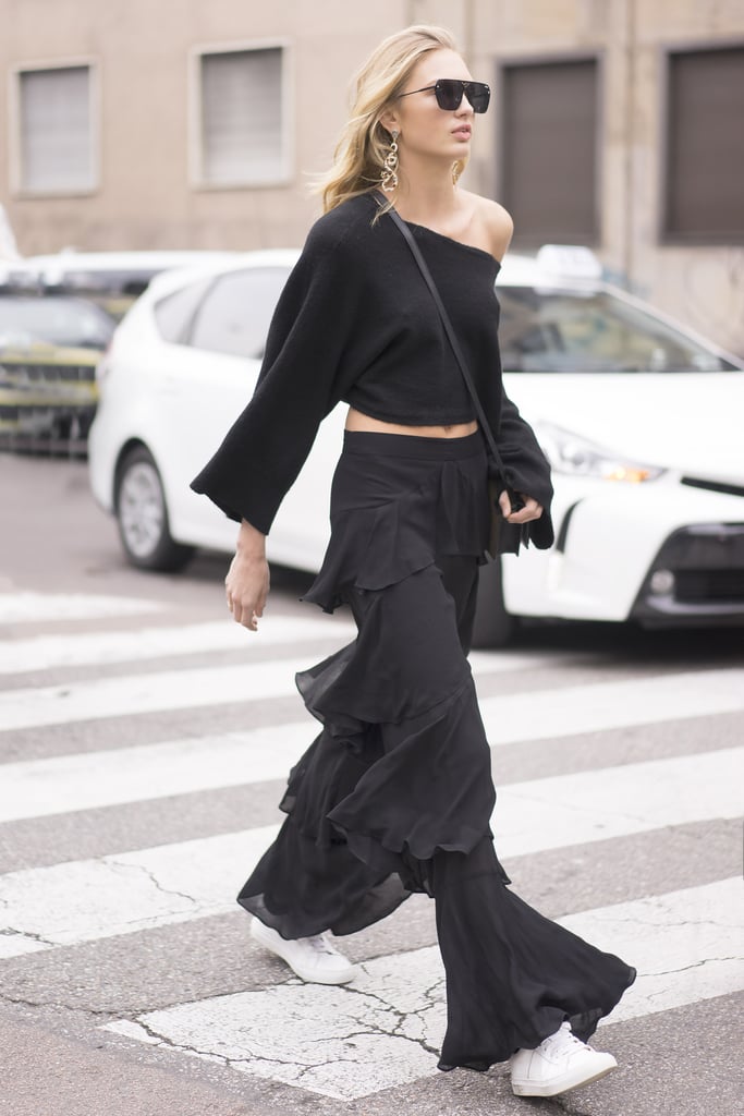 Let a raglan style crop top slip off one shoulder and play up the feminine vibes in ruffled pants.