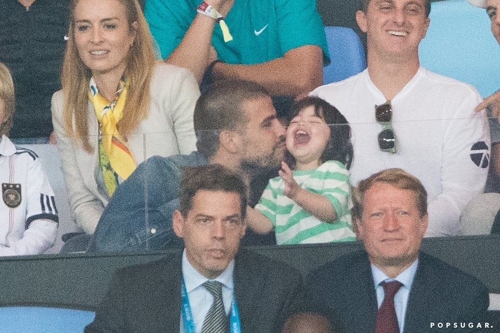 Gerard Piqué gave his son, Milan, a kiss.