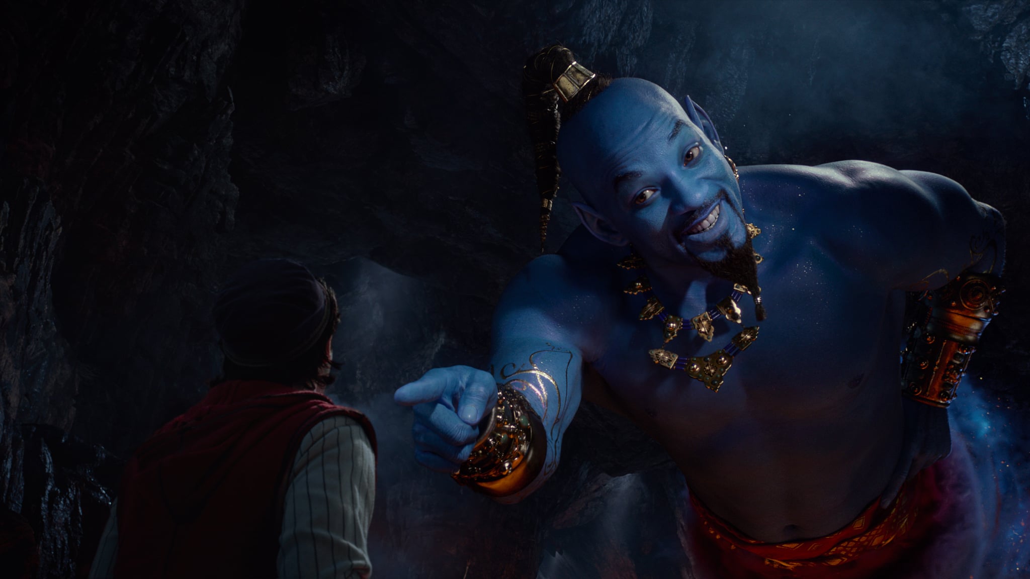 Aladdin (Mena Massoud) meets the larger-than-life blue Genie (Will Smith) in Disney's live-action adaptation ALADDIN, directed by Guy Ritchie.