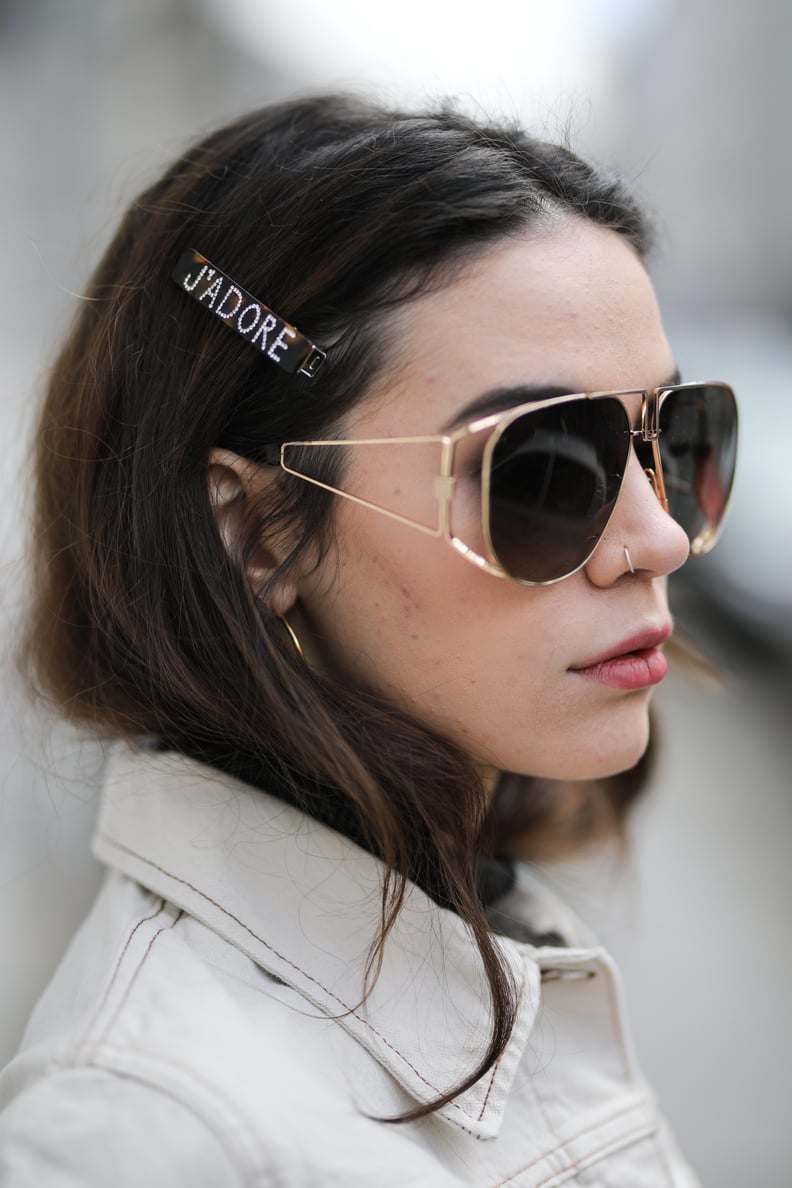 BERLIN, GERMANY - MARCH 19: Frankie Miles wearing white Denim jacket wrangler, pilote sunglasses givenchy, Hair clips Asos on March 19, 2019 in Berlin, Germany. (Photo by Jeremy Moeller/Getty Images)