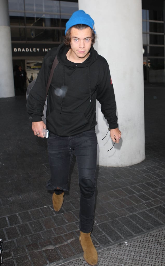 On Thursday, Harry Styles landed in LAX without his One Direction bandmates.