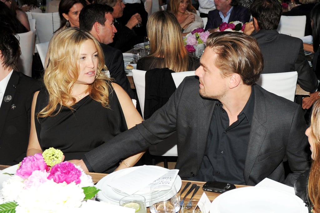 Leo chatted with Kate Hudson at a charity dinner in Malibu in June 2011.