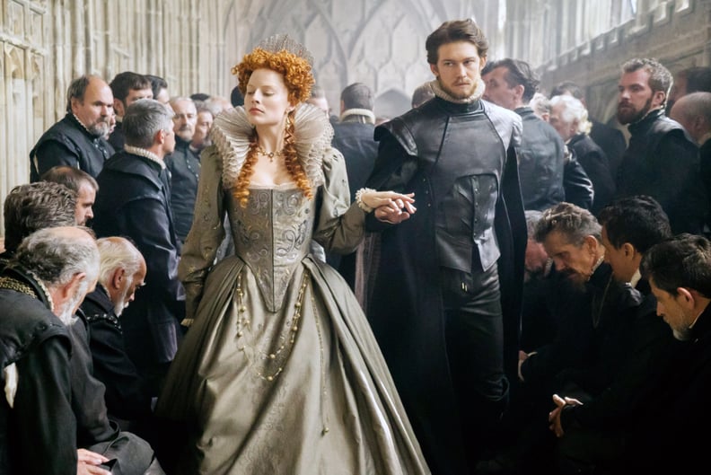 MARY QUEEN OF SCOTS, center from left: Margot Robbie as Queen Elizabeth I, Joe Alwyn as Robert Dudley, 2018. ph: Liam Daniel.  Focus Features /Courtesy Everett Collection