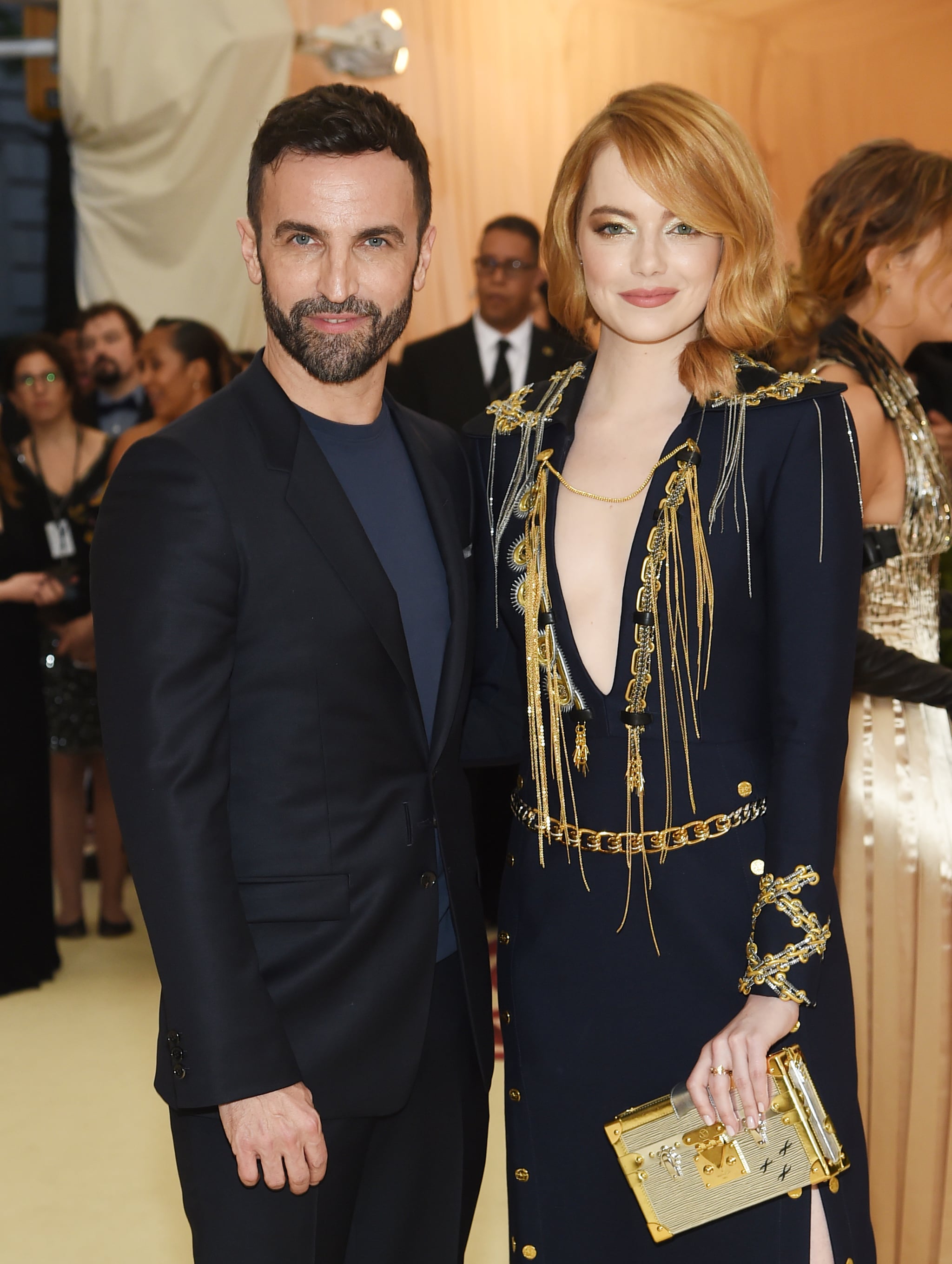 Emma Stone dons plunging navy and gold Louis Vuitton gown at Met