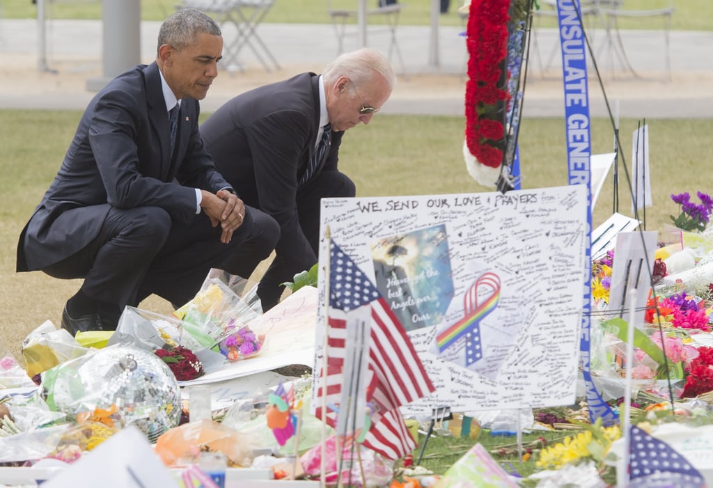 Signed posters, flowers, and flags make up the memorial to the victims of the Orlando shooting.