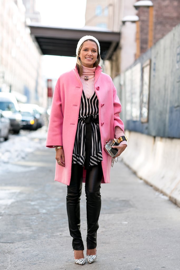 Helena Bordon mastered the layered look with a pink turtleneck, black-and-white tunic, and leather pants. Don't forget the last layer — statement jewelry!
