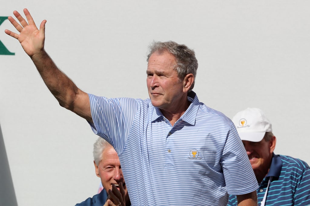Dubya waved to the crowd as Bill looked on.