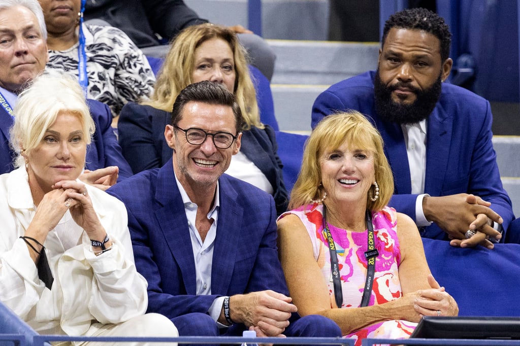 Hugh Jackman and his wife Deborra-Lee Furness on Aug. 29 at the US Open. Actor Anthony Anderson sits above them.