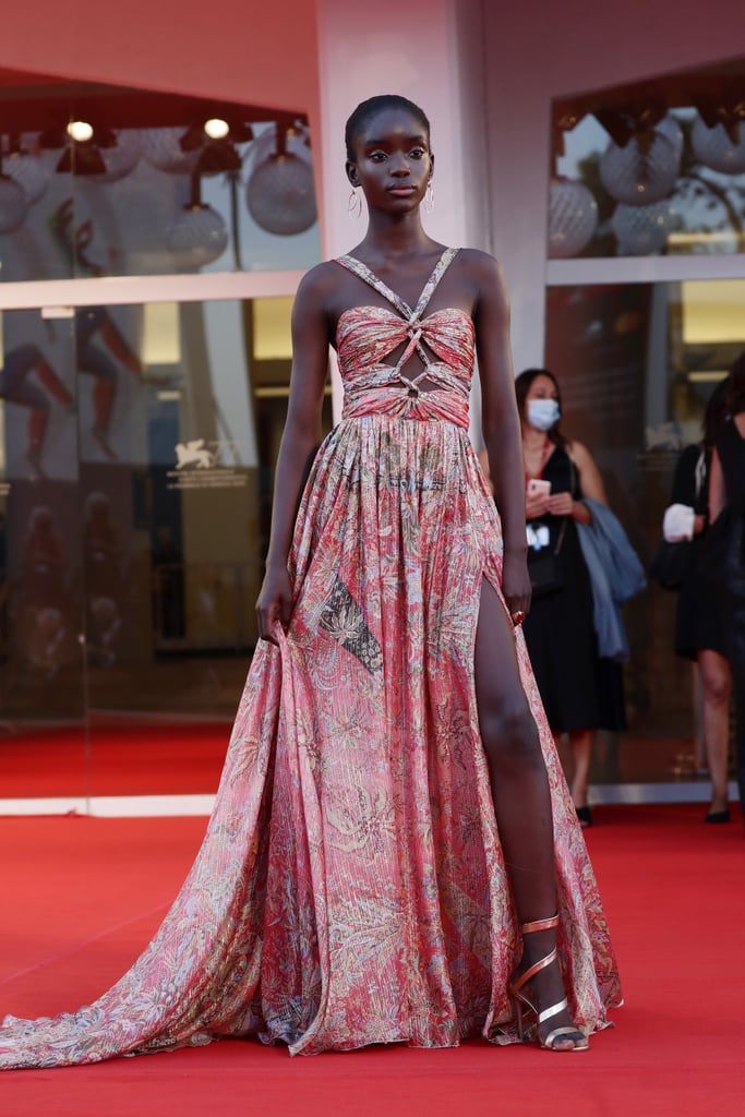 Maty Fall Diba wears a pink scarf-print gown by Etro and shoes by Pomellato.