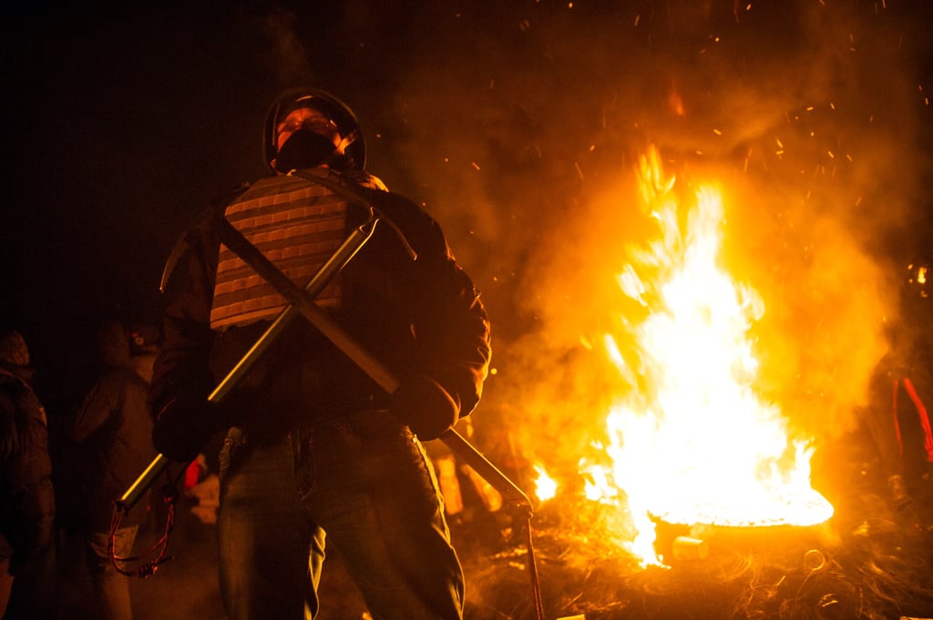 They burned tires beside their barricade in Kiev.