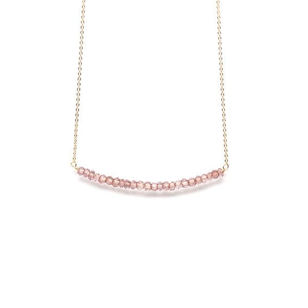 This necklace is simple and so classic. You could even get it with different colored beads. 
Emma Jane Designs Beaded Bar Necklace ($46)