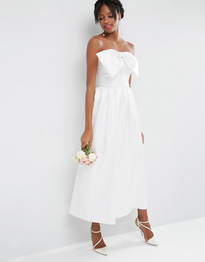 When choosing a wedding dress, or in this case jumpsuit, pay close attention to the neckline. We can't get enough of this fresh Asos Bridal Jumpsuit with Bow Detail ($181).
