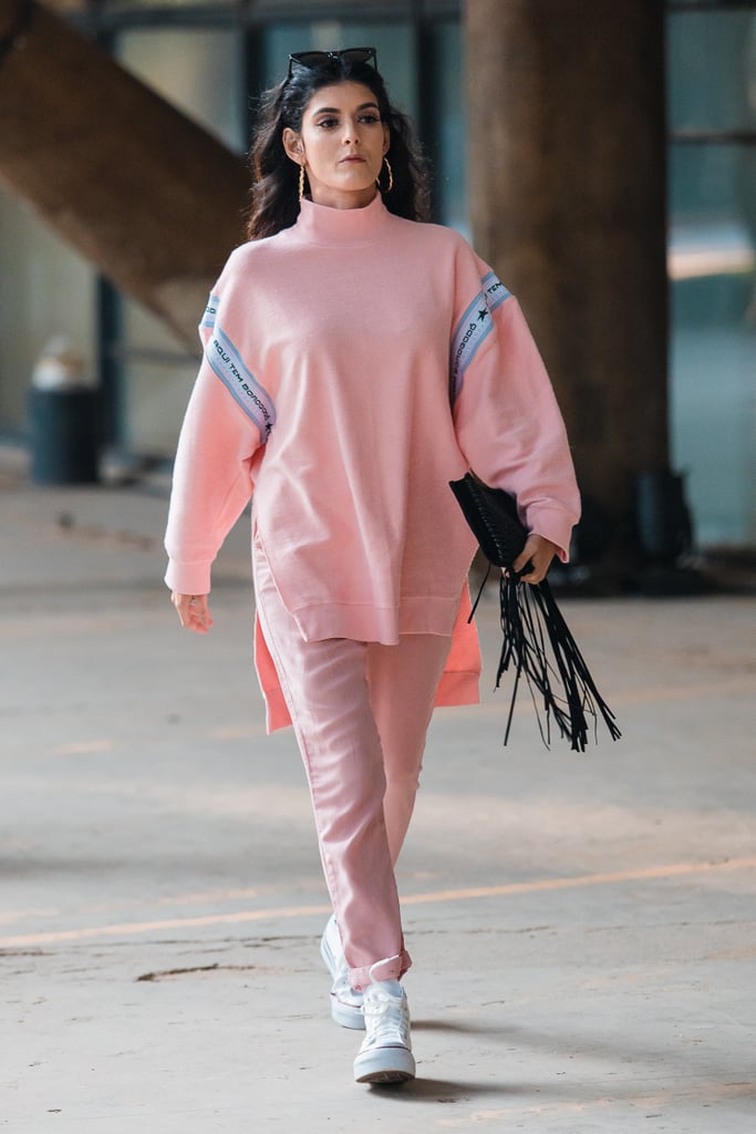With a Light Pink Sweater and Silk Trousers
