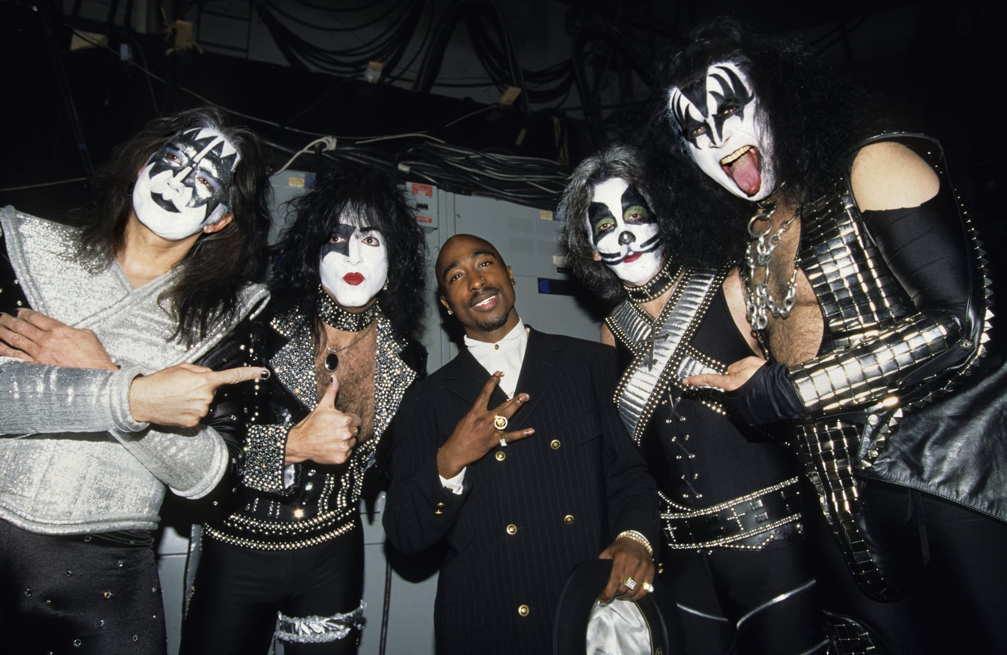 Tupac Shakur joined the members of Kiss backstage in 1996 — how hilarious is this photo?