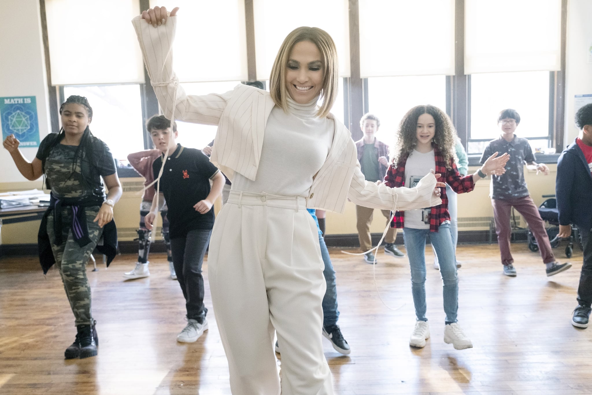 MARRY ME, Jennifer Lopez (front), Chloe Coleman (right of centre), 2022. ph: Barry Wetcher / Universal Pictures / Courtesy Everett Collection