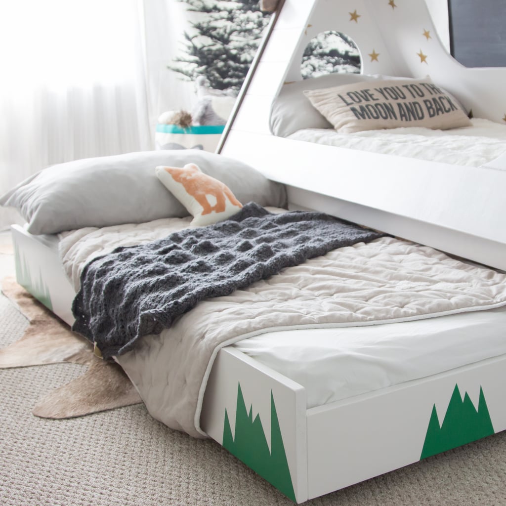 Thanks to a pullout trundle bed, her son can enjoy sleepovers with DIY Tepee Kids' Bed