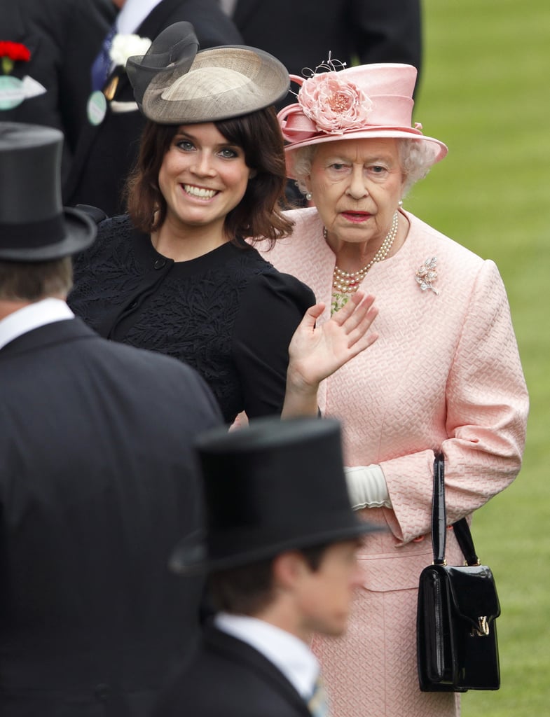 She waved to the photographers while standing with Queen Elizabeth II at the Royal Ascot in 2013.