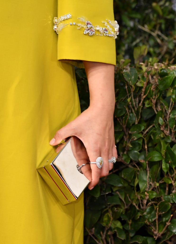 Wearing Tiffany & Co. rings.