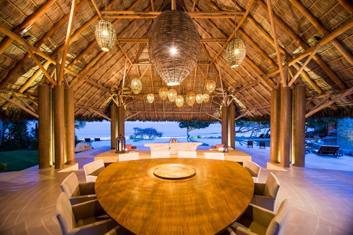 There are four dining rooms — one indoor and three outdoor — and each seats 12 people. The grand dining room and living palapa, however, are the center of the villa.