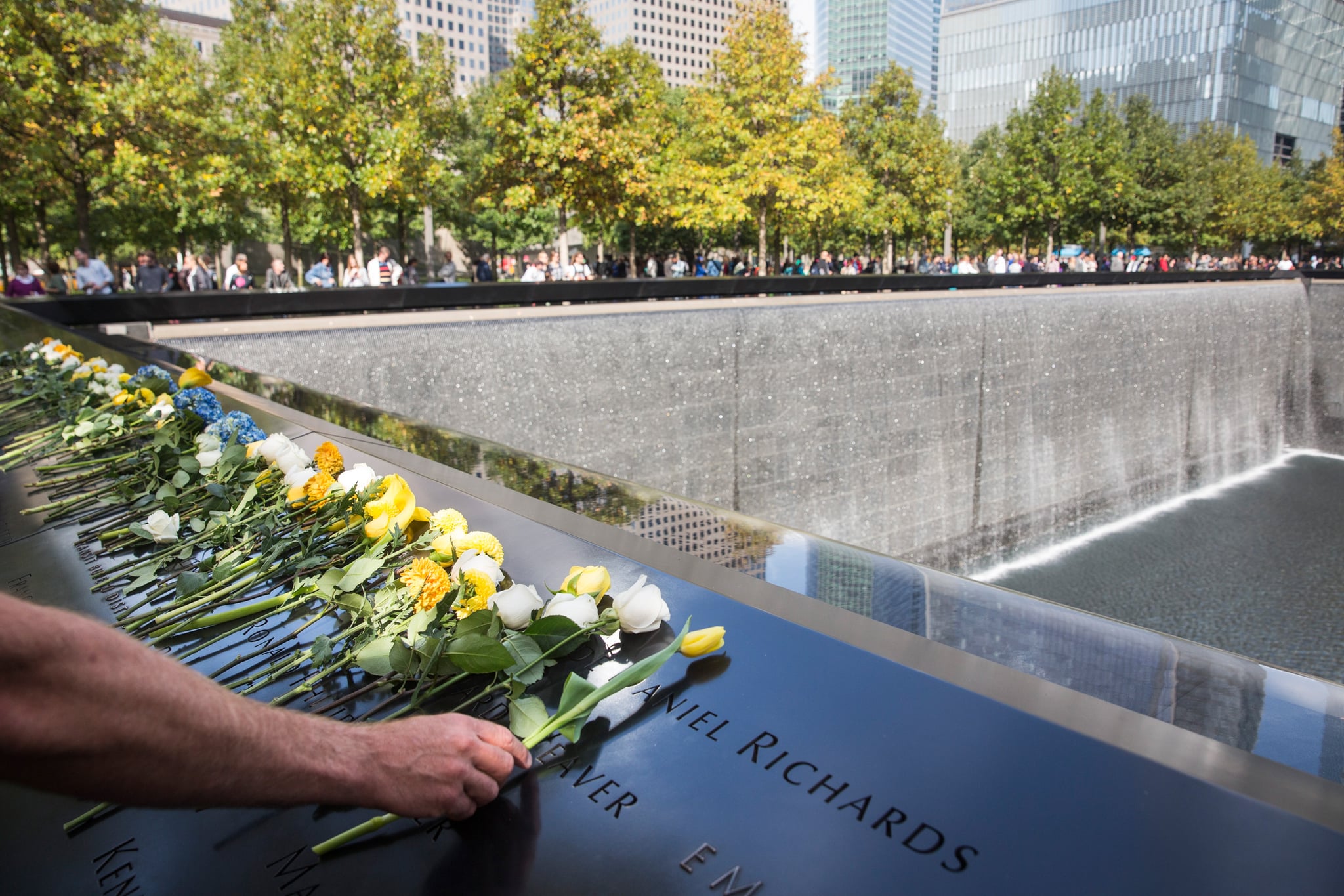 NEW YORK, NY - OCTOBER 22:  Flowers lay in tribute to slain New York Police Department officer Randolph Holder at National September 11th Memorial on October 22, 2015 in New York City. Holder was killed on Tuesday evening while in pursuit of a suspect.  (Photo by Andrew Burton/Getty Images)