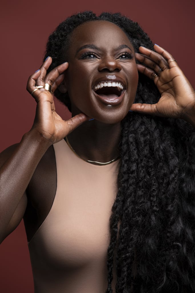 Even though she found her true calling in fitness, she could never abandon her love for beauty. Oyeneyin tries to incorporate it into her everyday job as much as possible, like by sharing her skin-care routine on her Instagram Story or IGTV. Like any skin-care-lover, she likes to try new things, but she has a few products that never leave her medicine cabinet. Those are the Dr. Dennis Gross Alpha Beta Universal Daily Peel ($88), the Farmacy Green Clean Makeup Removing Cleansing Balm ($22) to double cleanse followed by the Caudalie Vinopure Pore Purifying Gel Cleanser ($28), EleVen by Venus Williams Unrivaled Sun Serum SPF 35 ($50), Malin + Goet Recovery Treatment Oil ($82), and last but not least, SkinCeuticals Resveratrol B E ($153). "Girlfriend, I feel like you'd use that product for three days, and you just feel like you get a second skin, new and fresh and ready to go — I love it so much," Oyeneyin said of the serum.
The makeup routine she follows when she's teaching is just as serious as her skin-care regimen — but only if she's on-camera. "I make the joke I'm not at home riding this bike with a full face of makeup on," she said. Her essentials for those on-camera sweat sessions are the ColorStay Makeup For Combo/Oily Skin ($10), NARS Exhibit A Blush ($30), which she also uses in the crease of her eyes, and the Revlon So Fierce! Big Bad Lash Mascara ($8). The key to getting her products to stay, even during those extra sweaty rides, is simple — she relies on waterproof everything. 
The most eye-catching part of her entire makeup routine is always her lipstick, but unfortunately, she can't tell you what brand it is because it simply doesn't exist. "People are always asking me, right? Here's the thing: I use 17. . . so many different products on my lip to really get the end look that I want," Oyeneyin said. "But I am working on something that hopefully, one day, will be the answer to all of my lip solutions, and I'll be able to give one product instead of the 17 that I mix together." We'll just be here, patiently waiting for that day to come.