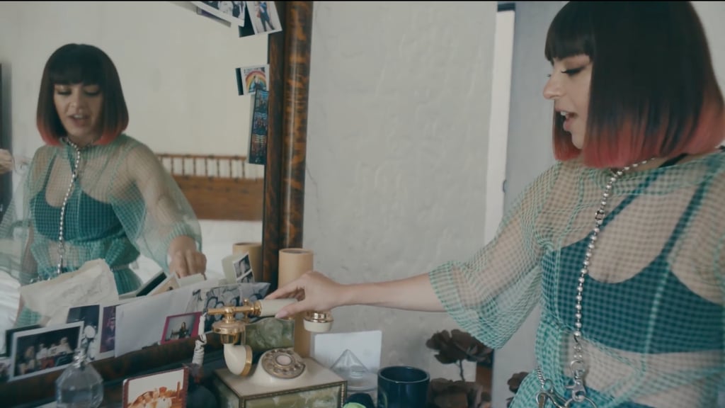 The dresser and mirror are covered with more pictures with friends. There's also an old-fashioned phone, which Charli said was one of the first things she bought for the home.