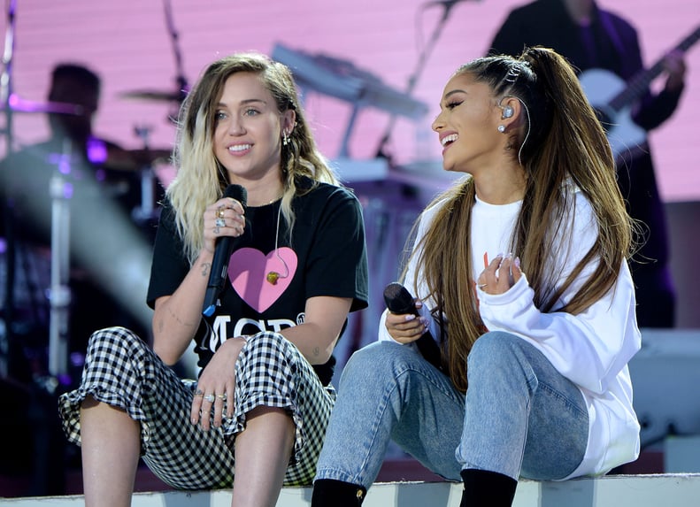 MANCHESTER, ENGLAND - JUNE 04:  Ariana Grande (R) and Miley Cyrus perform on stage during the One Love Manchester Benefit Concert at Old Trafford Cricket Ground on June 4, 2017 in Manchester, England.  (Photo by Kevin Mazur/One Love Manchester/Getty Image