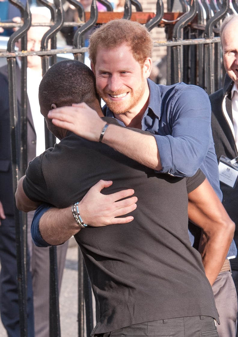 Harry hugged Russell Youth Centre Manager Trevor Rose while visiting the Community Recording Studio in 2016.