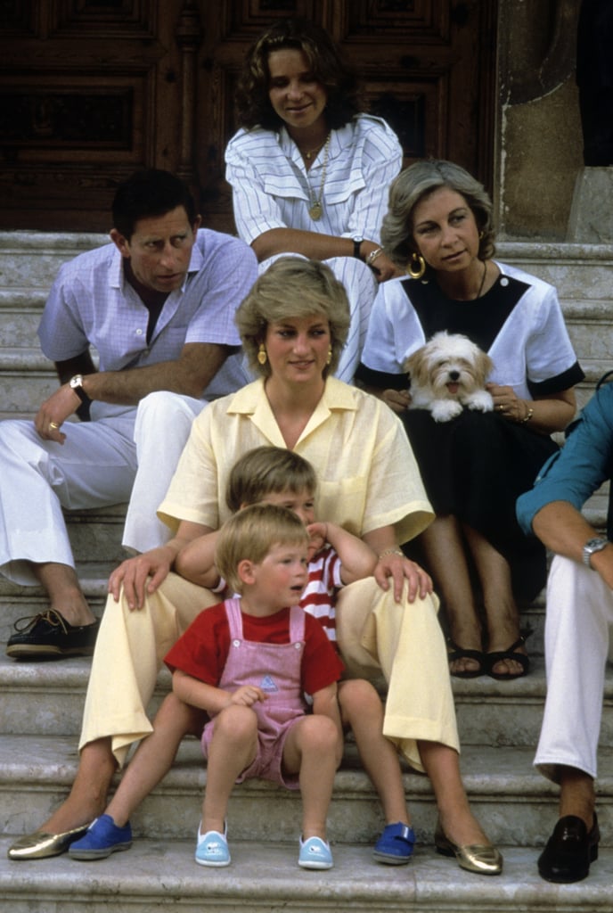 Both boys sat between their mum's legs during a casual outing in Spain in 1987.