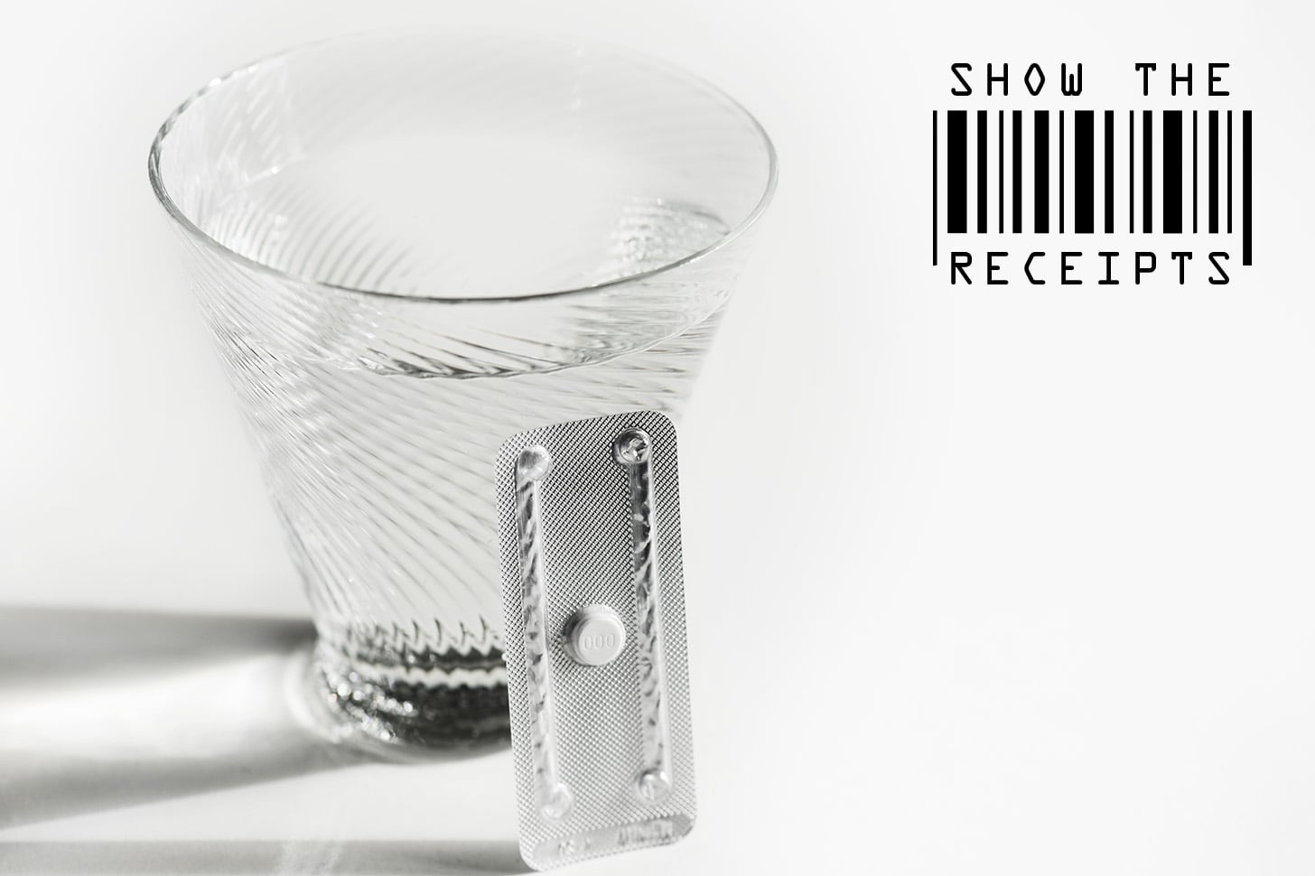 abortion pill and cup of water
