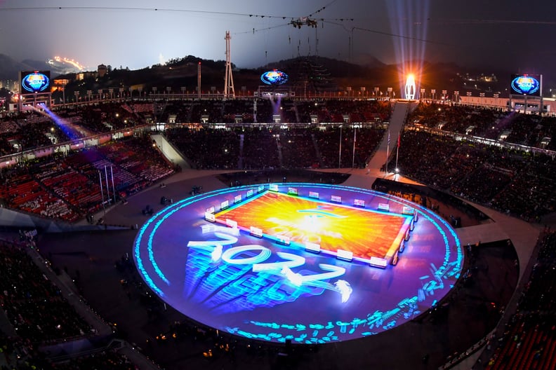 General view shows Beijing 2022 projected on stage during the closing ceremony of the Pyeongchang 2018 Winter Olympic Games at the Pyeongchang Stadium on February 25, 2018.The 2022 Winter Olympic Games will be held in Beijing. / AFP PHOTO / François-Xavie