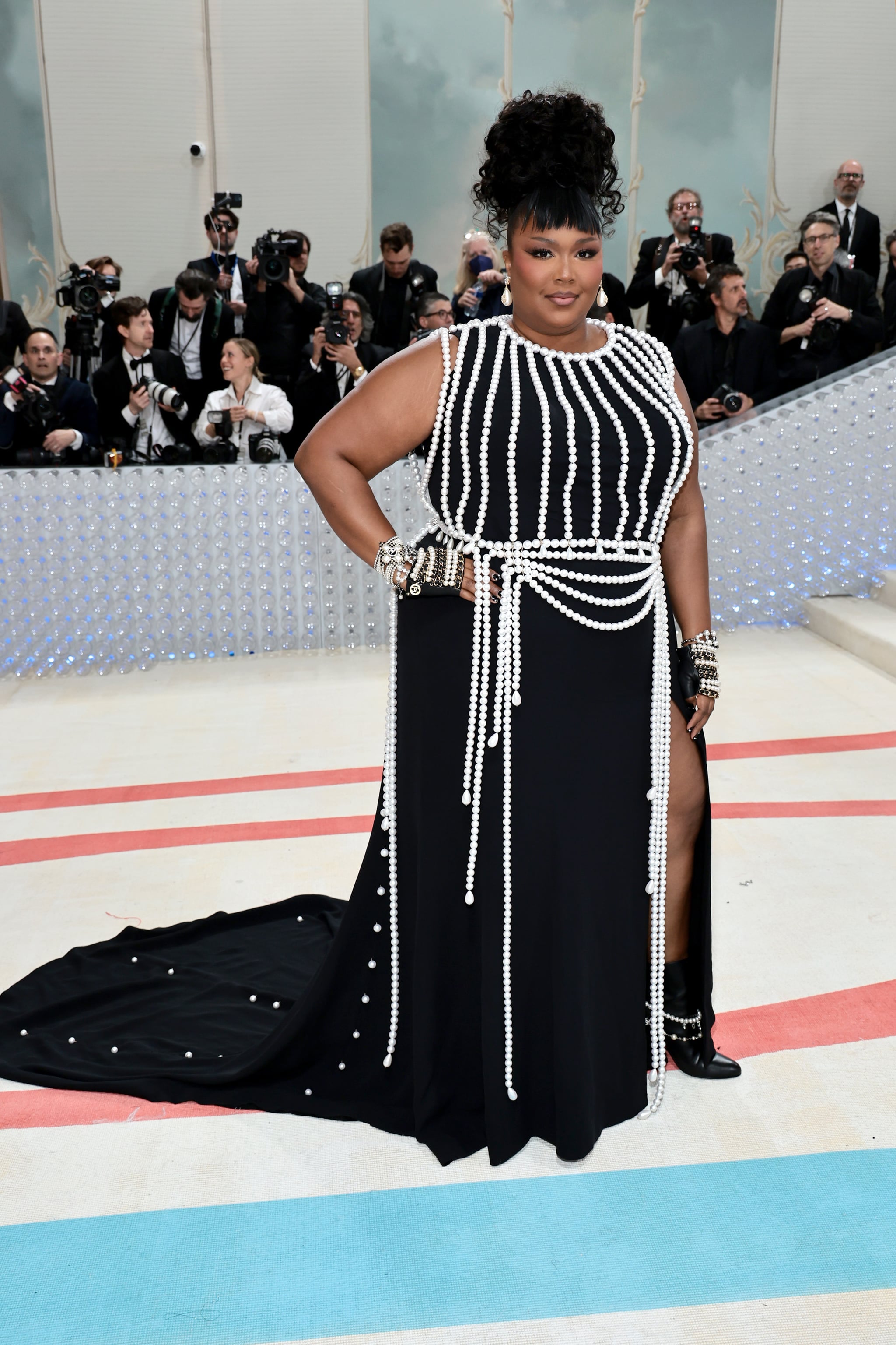 Lizzo attends the 2023 Met Gala with micro bangs.