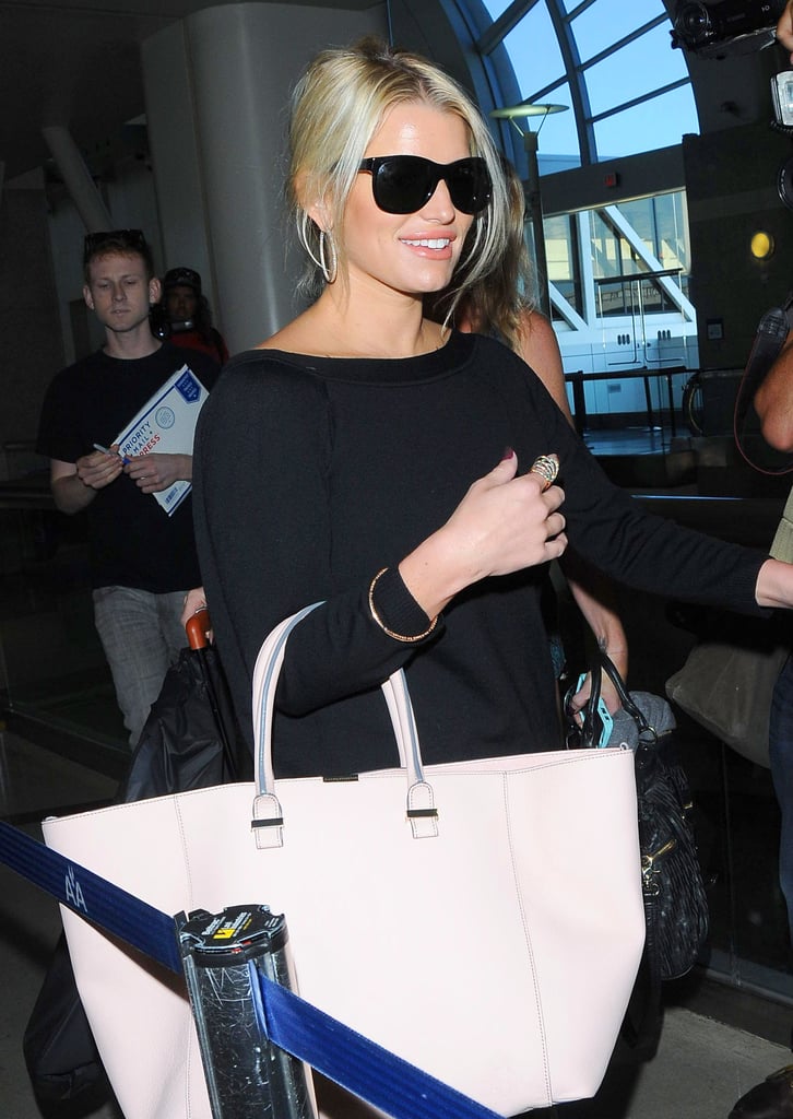 Jessica Simpson caught a flight out of LAX solo on Tuesday.
