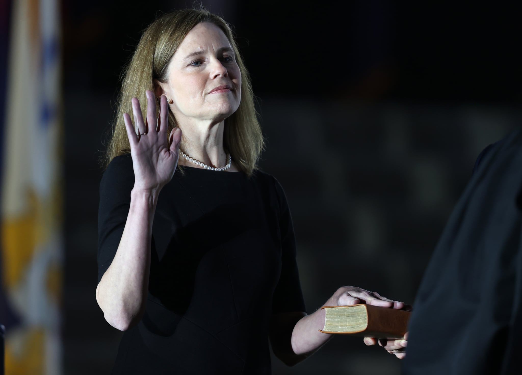 WASHINGTON, DC - OCTOBER 26: U.S. Supreme Court Associate Justice Amy Coney Barrett is sworn in by Supreme Court Associate Justice Clarence Thomas during a ceremonial swearing-in event on the South Lawn of the White House October 26, 2020 in Washington, DC. The Senate confirmed Barrett's nomination to the Supreme Court today by a vote of 52-48. (Photo by Tasos Katopodis/Getty Images)