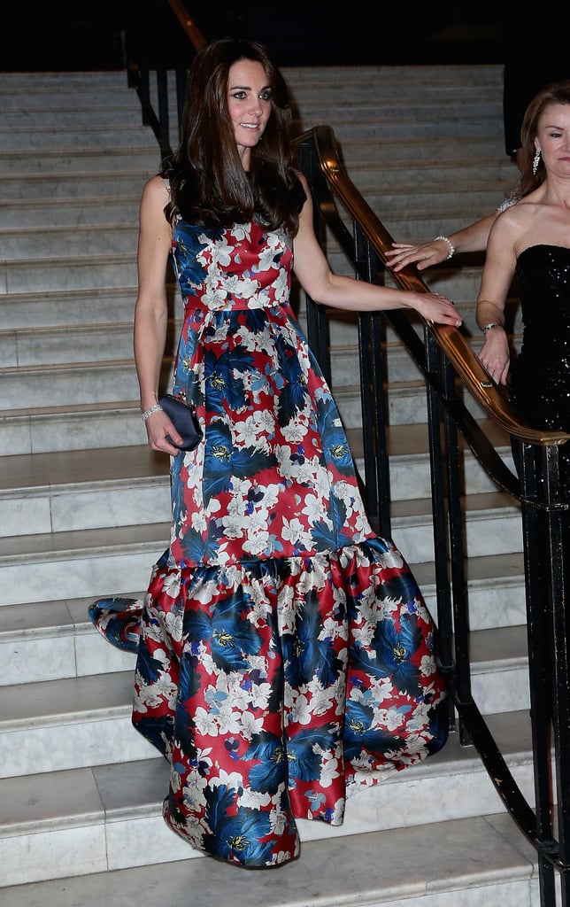 She held on to her satin clutch and let her tiered peplum train sweep the floor behind her.