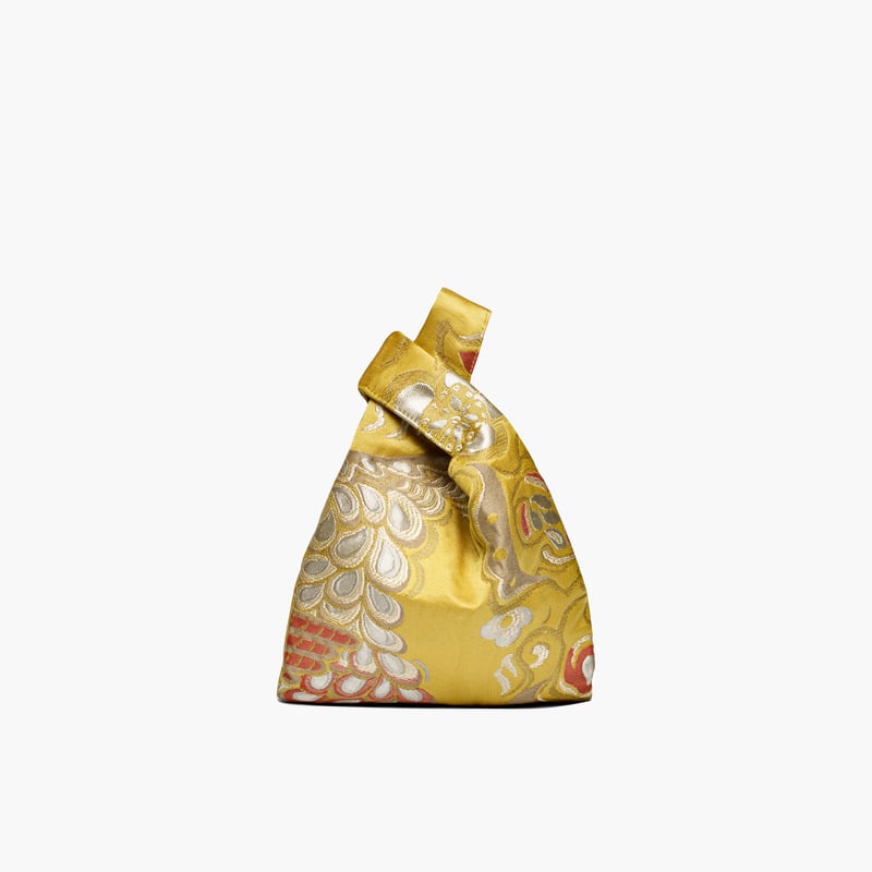 "Hayward's Mini Gold Brocade Shopper ($790) is well worth the splurge. This is a vintage-inspired piece I'll wear year round, and it comes in such a glowing, standout color too." — SW