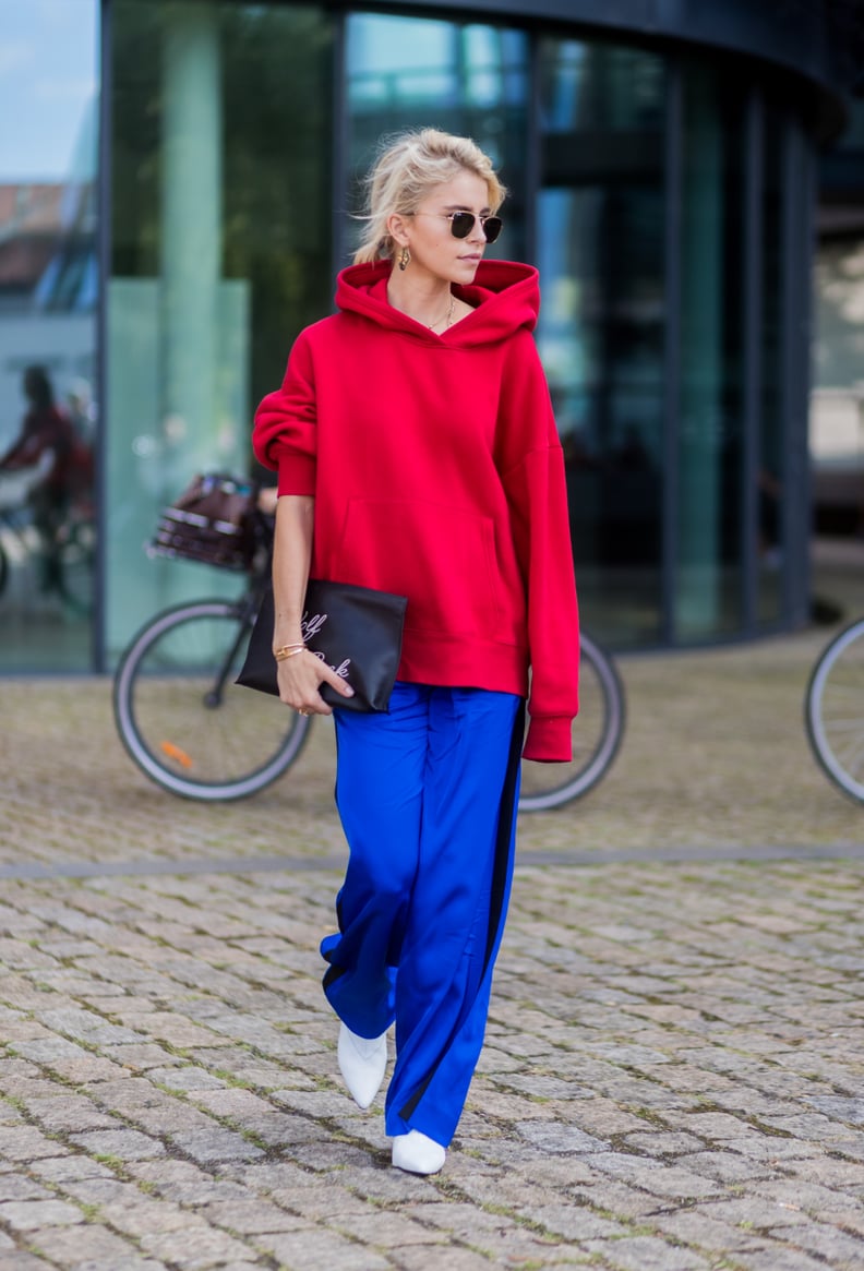 Put On Your Track Pants and Hoodie With Statement Earrings and White Booties